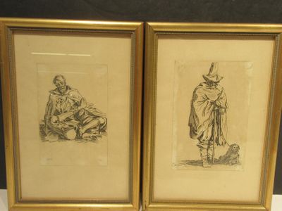 two framed drawings of a man and a woman sitting on the ground
