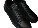 men ' s black leather sneakers with black laces on a white background