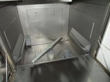 an open oven with a metal door in a kitchen