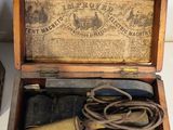 a wooden box with a pair of scissors inside of it