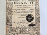 an old book with a black and white image of a seal on it