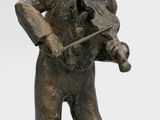 statue of a man playing a violin on a white background