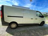 a white van that is parked on the side of the road