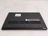 a laptop that is sitting on a white surface