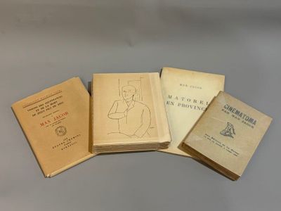 several books are stacked on top of each other on a table
