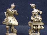 pair of antique brass figurines of a woman and a man
