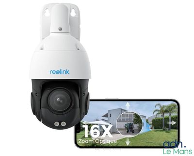 un appareil photo blanc avec un téléphone portable à côté et la photo d'une maison