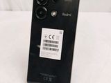the back of a black phone with a barcode sticker on it