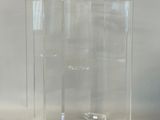 a clear glass vase sitting on top of a table