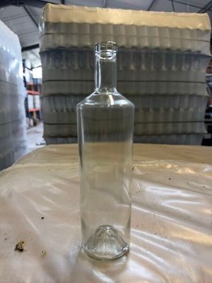 a bottle of water sitting on a table in a warehouse
