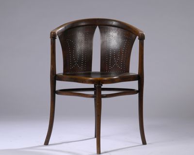 an image of a wooden chair with a brown leather seat