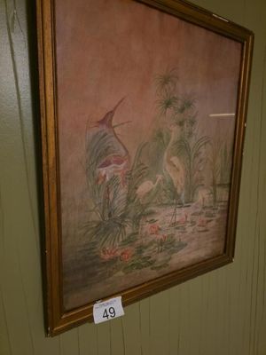 a picture of a painting hanging on the wall of a bathroom
