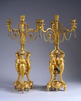 Grande paire de candélabres en bronze ciselé et doré à trois…