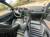 a picture of the interior of a car with leather seats