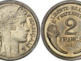 gros plan d'une pièce de monnaie sur laquelle figure une tête de femme