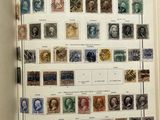 an open book with a bunch of stamps on the pages