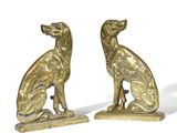 a pair of brass dog bookends on a white background