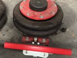 two black and red dumbbers sitting on the ground