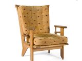 an image of a wooden chair with a yellow upholstered seat