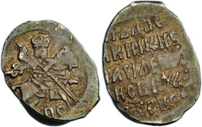 two ancient coins with roman writing on them