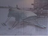 a picture of a plane that is sitting in the snow