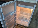 an open refrigerator with the door open and the light on