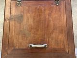 a wooden box that has a handle on it