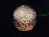 a close up of a moon in the dark sky with a black background