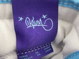 a close up of a shoe with a purple label on it