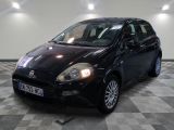 a picture of a small black car parked in a garage