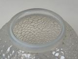 a clear glass vase with bubbles in it on a table