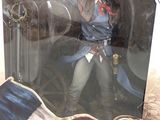 assassins creed action figure in a box on a table
