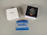a box with a watch inside of it on a table