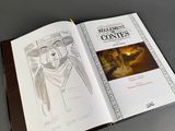 an open book with a drawing of a man in a cowboy hat