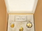 an image of a box containing a set of gold glass ornaments