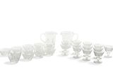 a lot of glasses that are sitting on a table