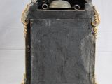 a small metal box with a skull inside of it