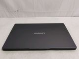 a laptop that is sitting on a white surface