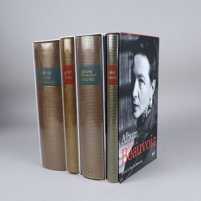 three books are stacked on top of each other on a table