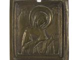an image of a metal plaque with a picture of a woman holding a child