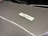 a sticker that says quality on the hood of a car