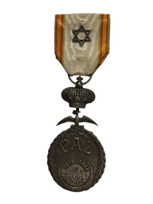 un gros plan d'une médaille sur laquelle figure une étoile de David