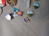 a lot of pins that are laying on a table