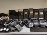 many different types of cell phones sitting on a table