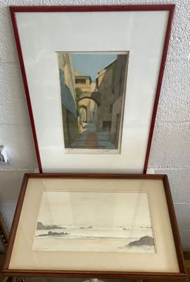 a picture of a cat sitting on a table next to a picture of a building