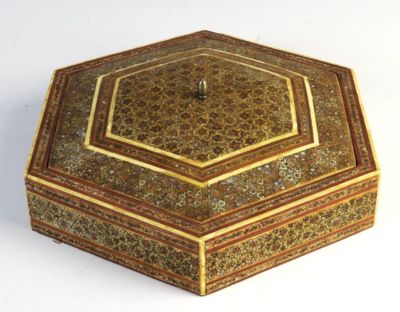 a decorative box that is sitting on a white surface