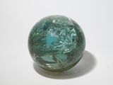 a glass ball with a blue star on it