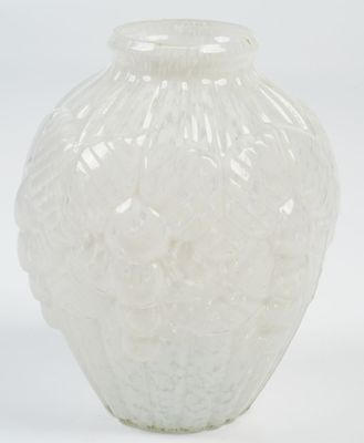 a white vase that is sitting on a white surface