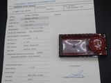 a red wax stamp sitting on top of a piece of paper