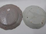 three plates that are sitting on a white surface